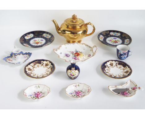 A gilt lustre teapot, porcelain chamberstick, butter dishes, and various other ceramic wares. 
