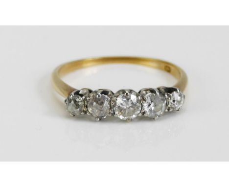 An Old Cut Diamond Five Stone Ring in a precious yellow and white gold setting, c. 3.9mm principal stone, KEE tests as 18ct, 