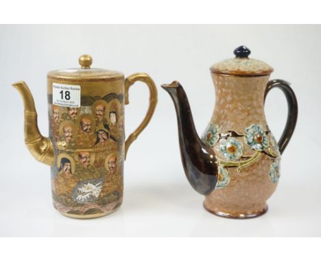 Japanese "1000 Faces" ceramic teapot and a Doulton Lambeth example, numbered 9431