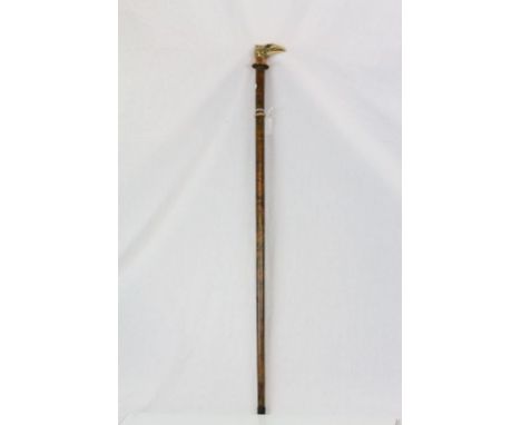 Walking stick with a brass eagle head terminal 