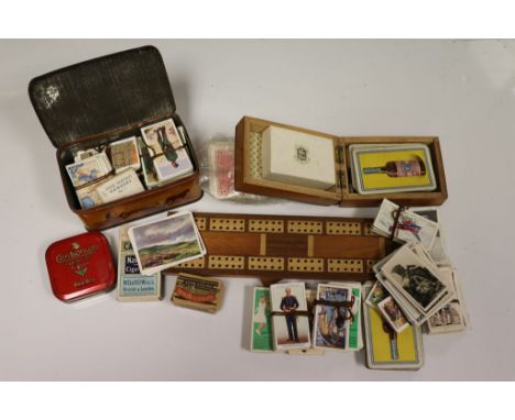 A shoe box of cigarette cards, Kensitas flowers and playing cards