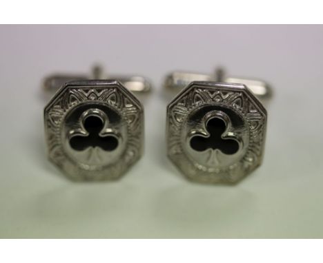 A pair of silver cufflinks inset with enamel