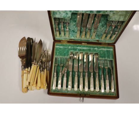 Small box of vintage Bovine bone handled flatware plus a canteen of vintage mother of pearl handled and engraved blades etc w
