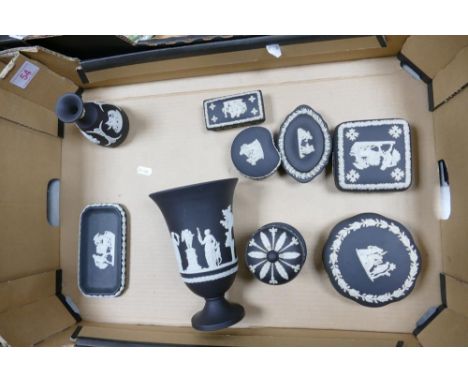 A collection of Wedgwood Black Basalt items including Urn, lidded boxes, vase , pin trays etc 