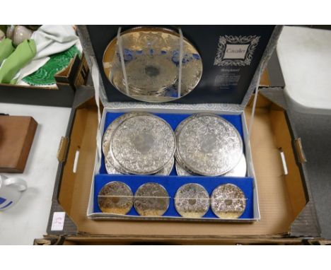 A boxed vintage set of Cavalier silver plated coaster place mats 