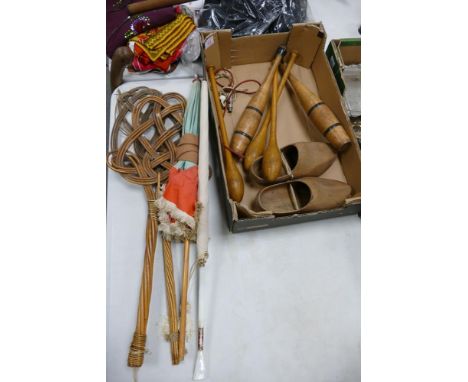 A mixed collection of items to include vintage wooden clogs, exercise bats, parasols,  Wicker carpet beaters etc 