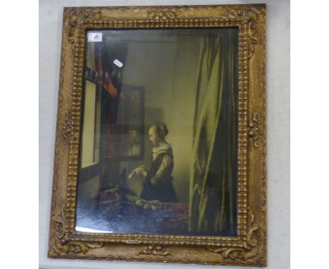 A Framed Print of Johannes Vermeer's 'Girl Reading a Letter at an Open Window'. Height: 69.5cm Width: 56.2cm 