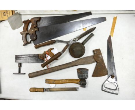 A collection of vintages tools to include files, axes, saws etc 