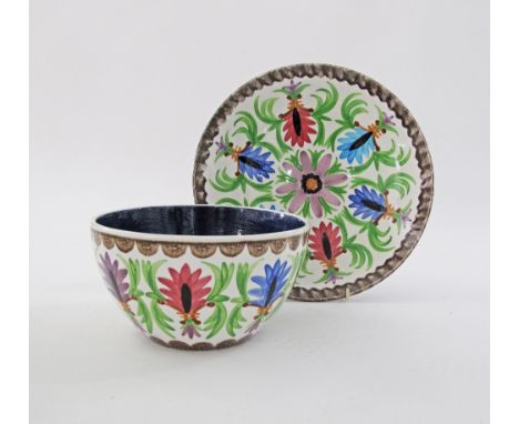 A set of two Greek Keramikos ceramic dishes, a charger W29cm and a bowl hand decorated with colourful foliage W20cm, stamped 