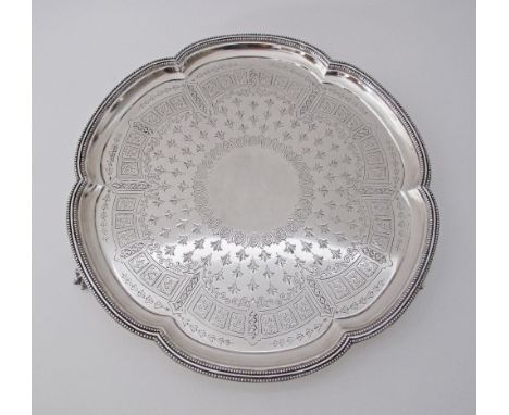 An engraved Sterling silver six lobbed salver, on three feet, Sheffield 1879. W37cm, Weight: 1200g