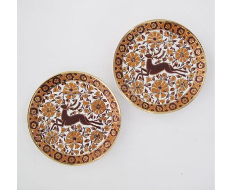 A pair of Greek Rhodian ceramic plates hand decorated with deer. Marked J BISCUS Rodos - Hellas, W24cm. (2)