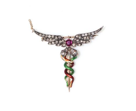 A GOLD  BROOCH Designed as a medical practitionerâ€™s pin, centered with a claw-set ruby, weighing approximately 0,30ct, pavÃ