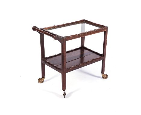 A MAHOGANY TEA TROLLEY, MID 20th CENTURY The rectangular glass top within a conforming frame, a conforming shelf below, on sq