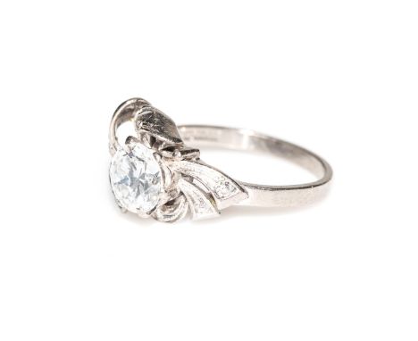 A DIAMOND RING Claw-set to the centre with a round brilliant-cut diamond, weighing approximately 1,20ct, colour F-G, clarity 