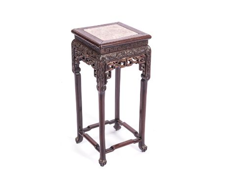 A CHINESE JARDINIERE STAND The square inset marble top above a key fret border, pierced and carved apron and spandrels, on sq