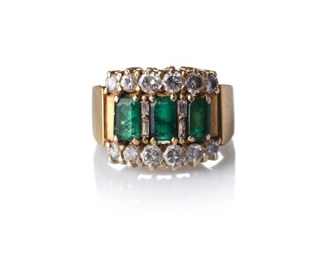 A DIAMOND AND EMERALD RING Claw-set to the centre with three rectangular-cut emeralds with a combined weight of approximately