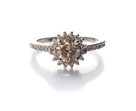 A DIAMOND RING Claw-set to the centre with a round brilliant-cut diamond, weighing 1,23ct, colour brown, certified by an AGL 