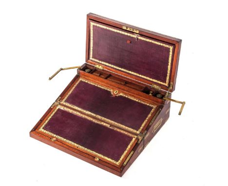 A VICTORIAN MAHOGANY TRAVELLING WRITING SLOPE The hinged rectangular top enclosing a gilt-tooled inset leather writing surfac