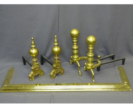 BRASS FIRE DOGS, two substantial pairs, 52cms H and 51cms H, and a brass fender