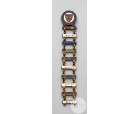 Gilt-metal and enamel Colchester United Supporters Club lapel badge, with ten bars dating from 1948-49 to 1959-60, enamel los