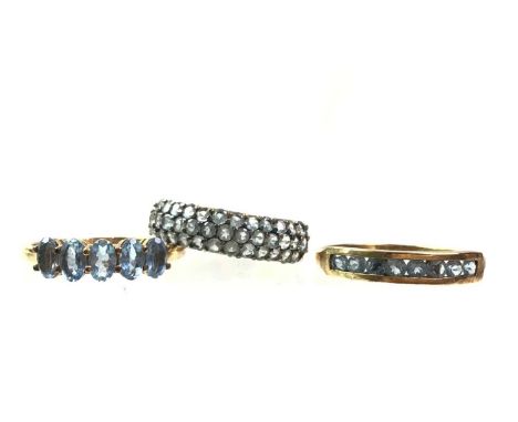 THREE BLUE GEM SET RINGS, each in nine carat gold, one size P 1/2, the others R 1/2Qty: 6.4g gross