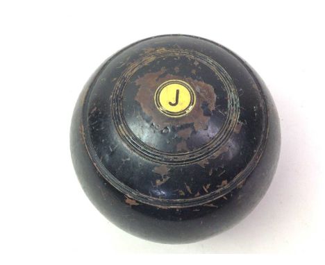 TWO SETS OF LAWN BOWLS, dark brown and ebonised