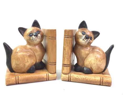 PAIR OF CARVED CAT BOOKENDS, ALONG WITH A BOOK TROUGH also a carved book slide and a bronzed plaquethe bookends 15.2cm high