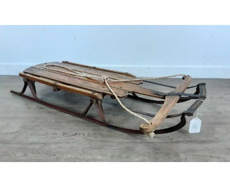 FLEXIBLE FLYER NO. 2 VINTAGE SLEDGE, EARLY 20TH CENTURY  maker Sla &amp; Co, constructed from stained oak planks and cast iro