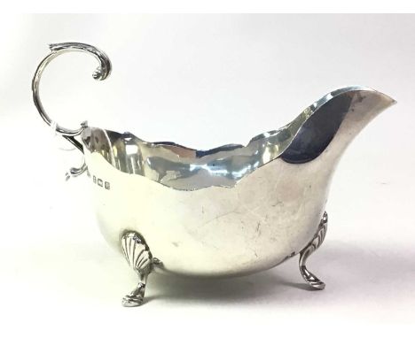 SILVER CREAM JUG, along with a small weighted candlestick (2)Qty: Jug 106g