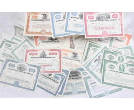 A collection of early 20th century share certificates including Tobacco Products Corporation, United Stores Corporation, Trai
