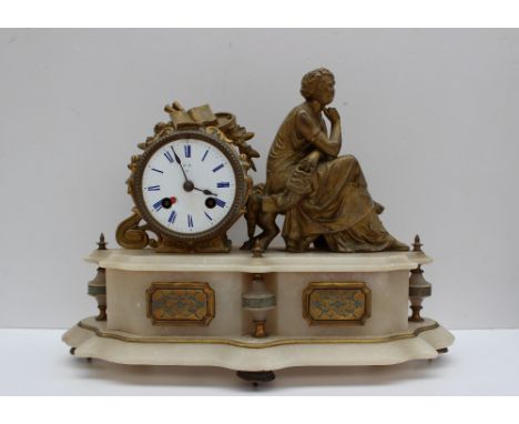 A 19th century gilt metal and alabaster mantle clock, with a seated female figure holding a mask, the enamel dial with blue R
