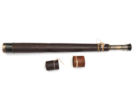 A single draw brass telescope, by “W. Ottway & Co Ltd, Ealing, London No 1899”, etc, brown leather covered body, with lens ca