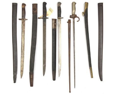 A Lebel bayonet,  with hooked quillon, in scabbard (some wear and rust); 3 other bayonets in scabbards; a scabbard for 1875 s