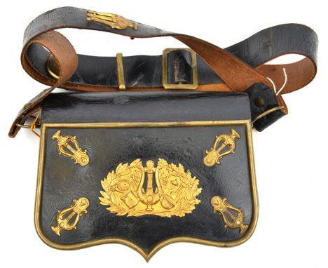 A 19th century continental bandsman’s black PL shoulder belt and pouch, brass border to panel flap with gilt brass trophy of 