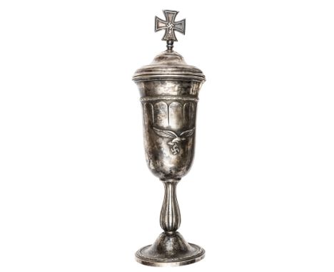 A German silver plated cup,  height 13½” including lid, the body of the cup having superimposed metal Luftwaffe eagle and swa