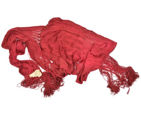 An officer’s scarlet sash and tassels, part of old label attached reads “Scarf worn by Capt Blake....Battle of Preston Pans..