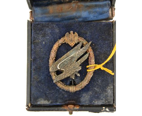 A Third Reich Army Parachutists badge  of heavy cast WM construction, with domed rivets, GC (some dark staining), in an appar
