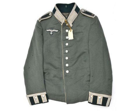 A Third Reich Army NCO’s dress tunic, of an Infantry Feldwebel, the epaulettes, collar and cuffs all with silver lace edging,