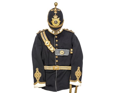 A good Lieutenant’s full dress uniform of the Army Service Corps, dated 1911 comprising: blue cloth ball topped helmet, with 