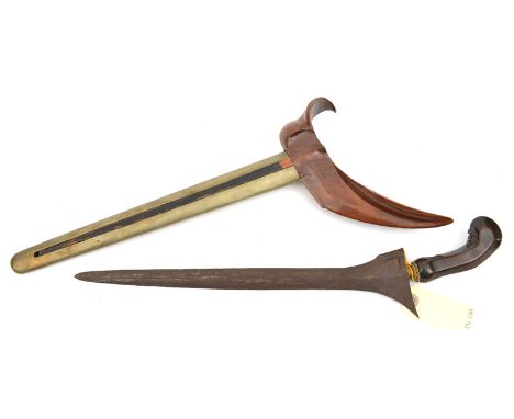A late 19th century Java kris, straight blade 14”, shallow panels at forte, gilt beaded cup to polished, facetted semi pistol