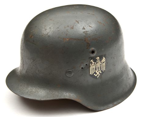 A German M42 style steel helmet,  the grey painted skull with single third reich army decal but with incorrect style liner an