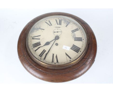 Two oak cased wall clocks, the cream painted dials with Roman numerals and subsidiary seconds dials, 26cm diameter, Smith Ala