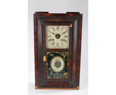 Ansonia Clock Co American wall clock, the white dial with Roman numerals above a foliate decorated glazed door, 39cm wide, 66