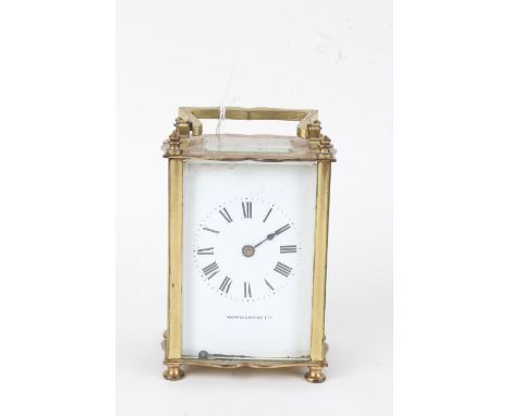 French brass carriage clock, the angular handle above a white dial with Roman numerals and retailers name Mappin &amp; Webb, 