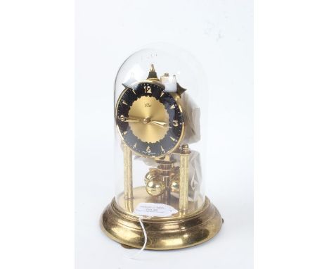 Elo brass anniversary clock, under glass dome, the circular dial with Arabic numerals, 21cm high