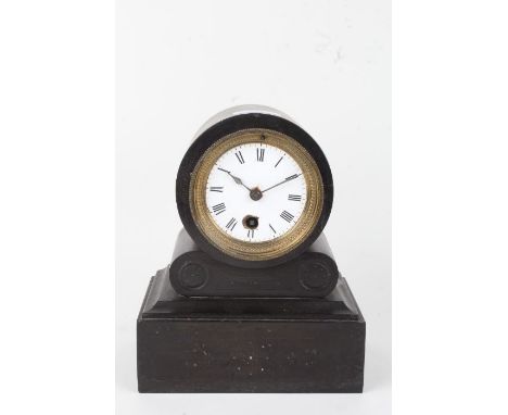 Edwardian slate mantel clock, the white enamel dial with Roman numerals, the case with carved roundel decoration, on a plinth