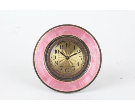 Puce enamel decorated boudoir clock, the circular case with puce enamel bezel, the engine turned brass dial with arabic numer