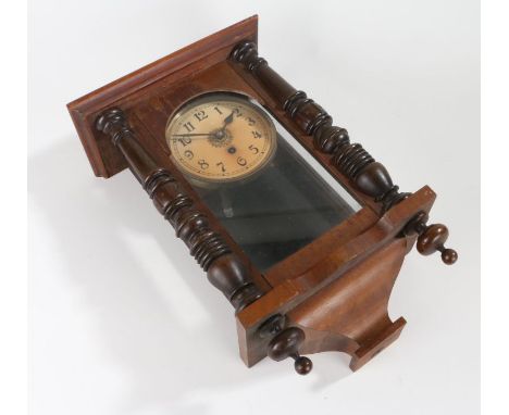 Edwardian mahogany wall clock, the cream dial with Arabic numerals, the glazed door flanked by carved half pilasters, 28.5cm 