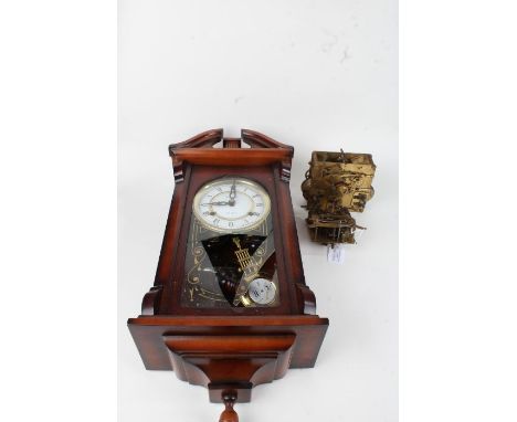 Two brass clock movements, together with a modern 31 day wall clock AF (3)