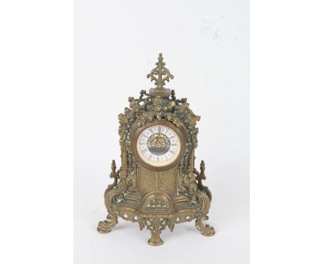 20th Century cast brass mantel clock, in the French style, the white dial with black Roman numerals, 23cm high